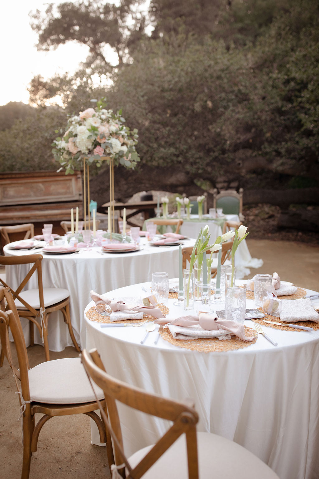 Wedding venue with wedding florals and a piano in the background